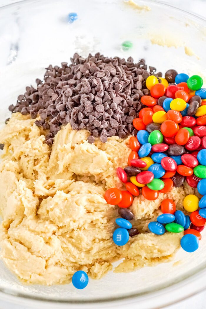 M&Ms and mini chocolate chips added to bowl