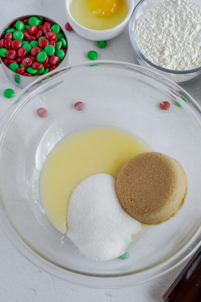 Melted butter, sugar, and brown sugar added to bowl