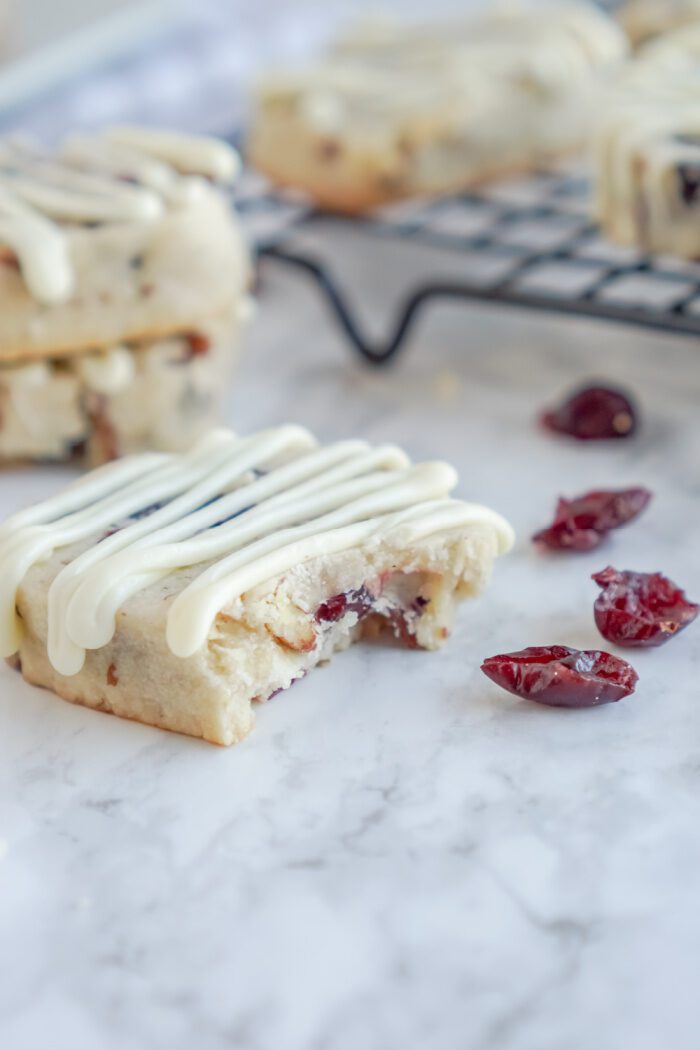 Bite Taken out of Pecan Cranberry Shortbread Cookie