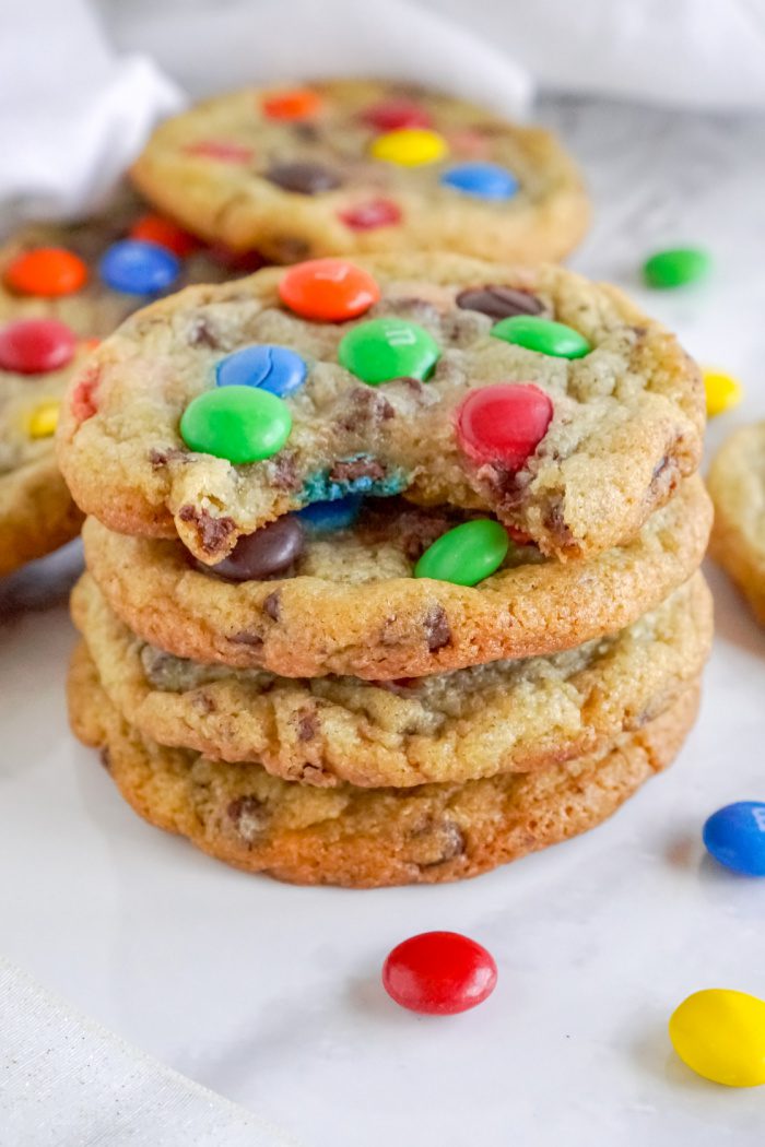 Stack of M&M Cookies With a Bite Taken Out of the Top Cookie