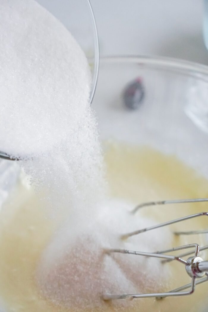 Sugar being added to bowl