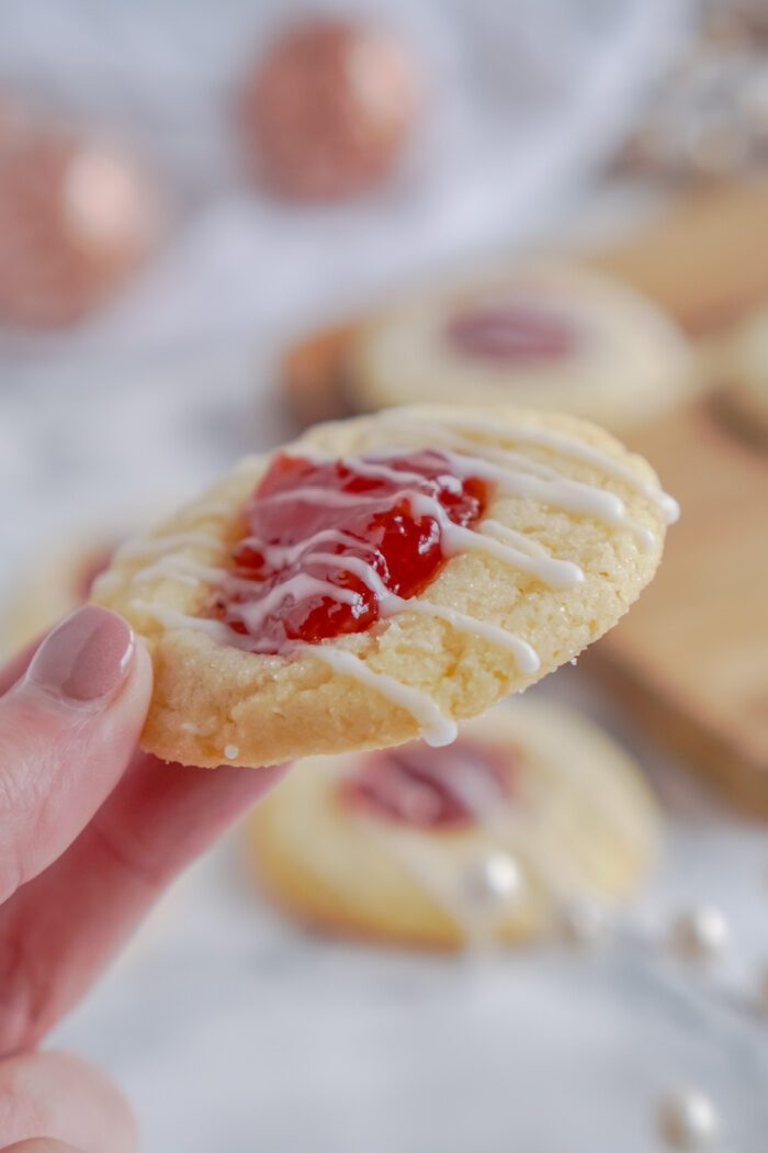 Someone Holding a Thumbprint Cookie