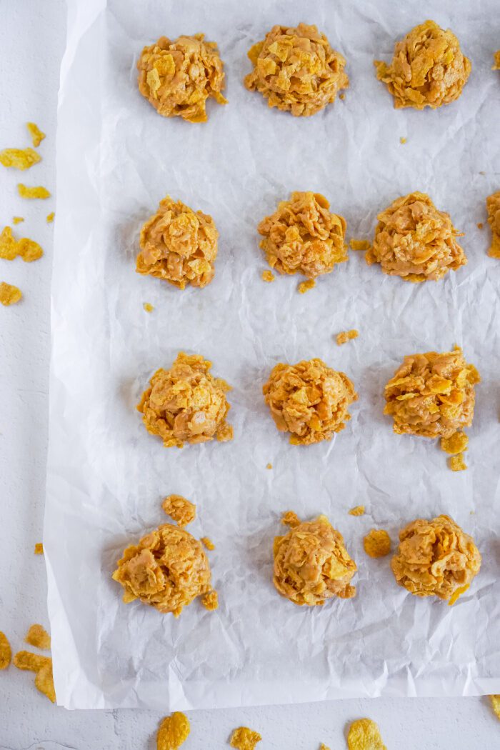 Cornflake Cookies Lined Up on Baking Tray