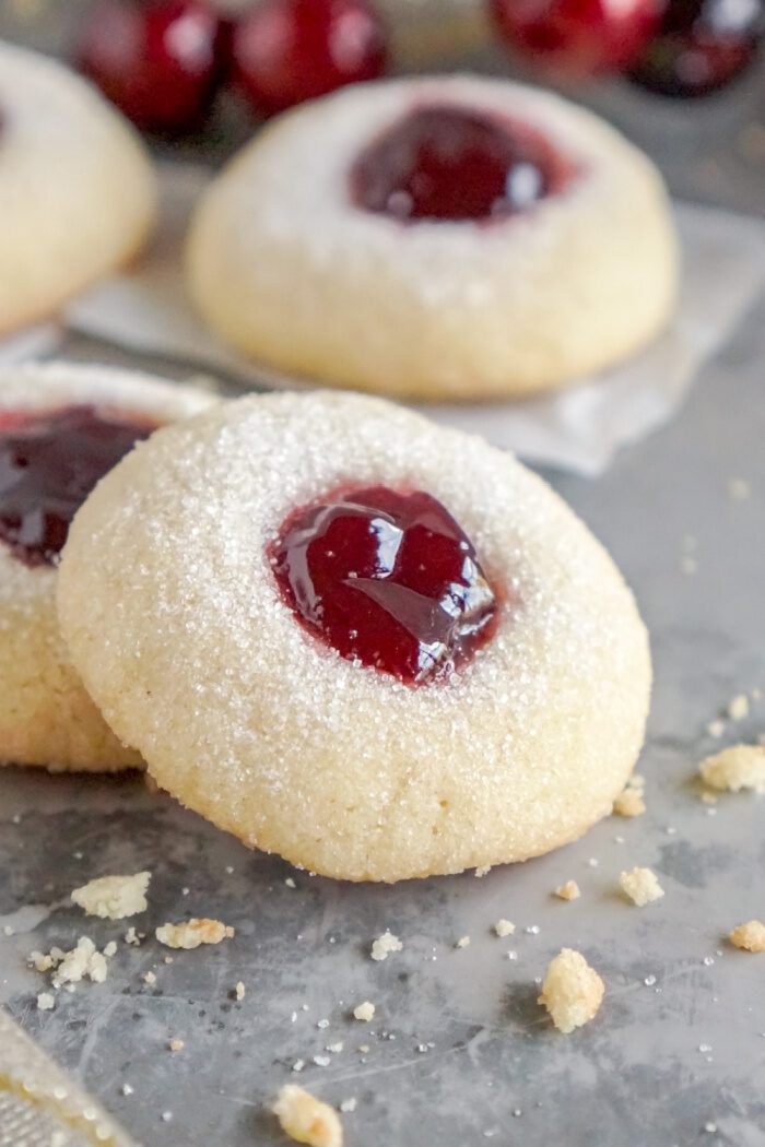 A close-up image of several thumbprint cookies.