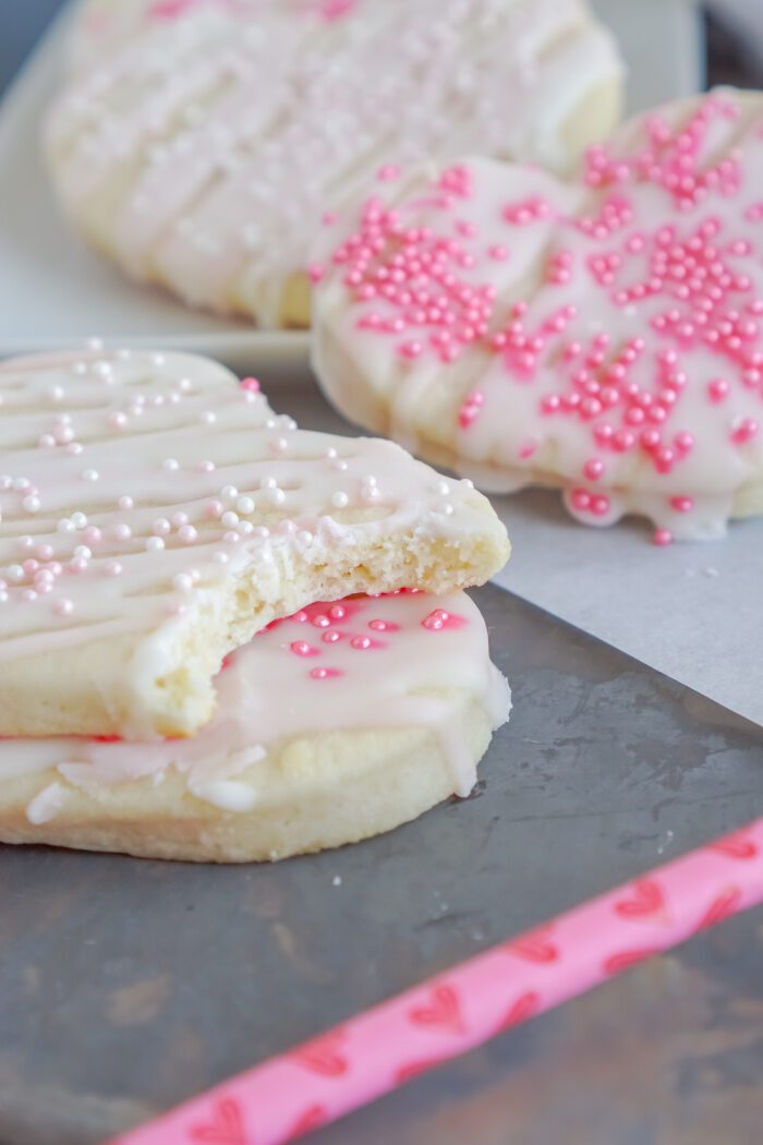 Stack of Valentine's Day Cookies With a Bite Taken Out Of the Top Cookie