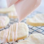 Icing Being Drizzled on Sugar Cookies