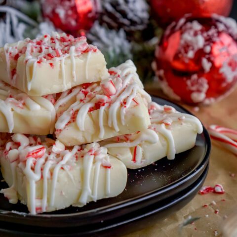 White Chocolate Candy Cane Fudge Squares on a Plate