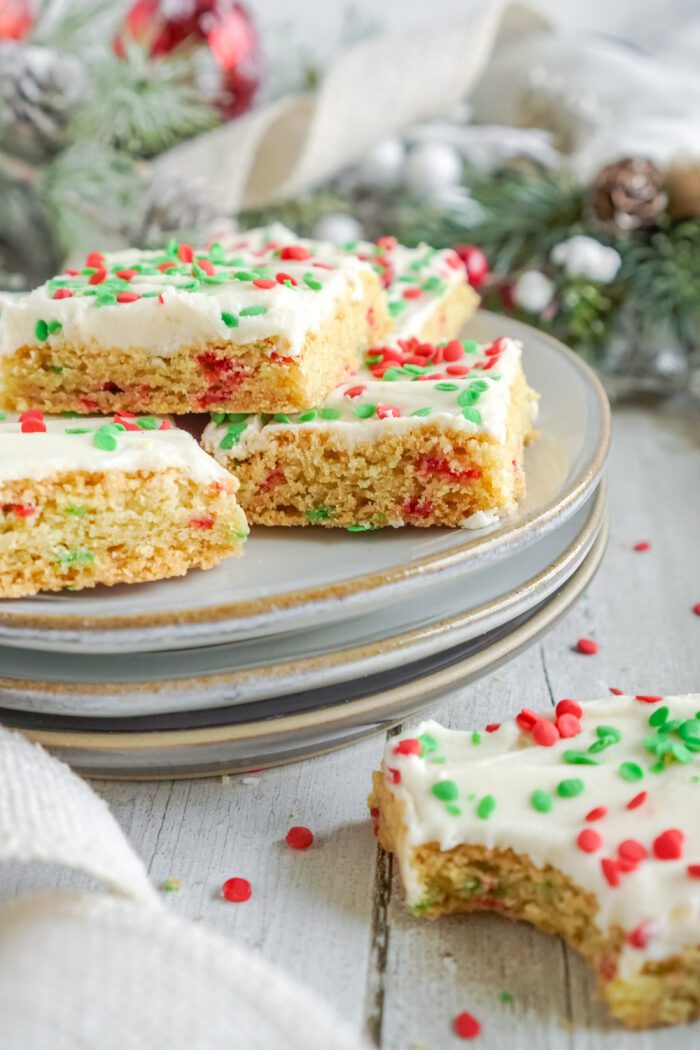 A plate of Christmas-themed sugar cookie bars.