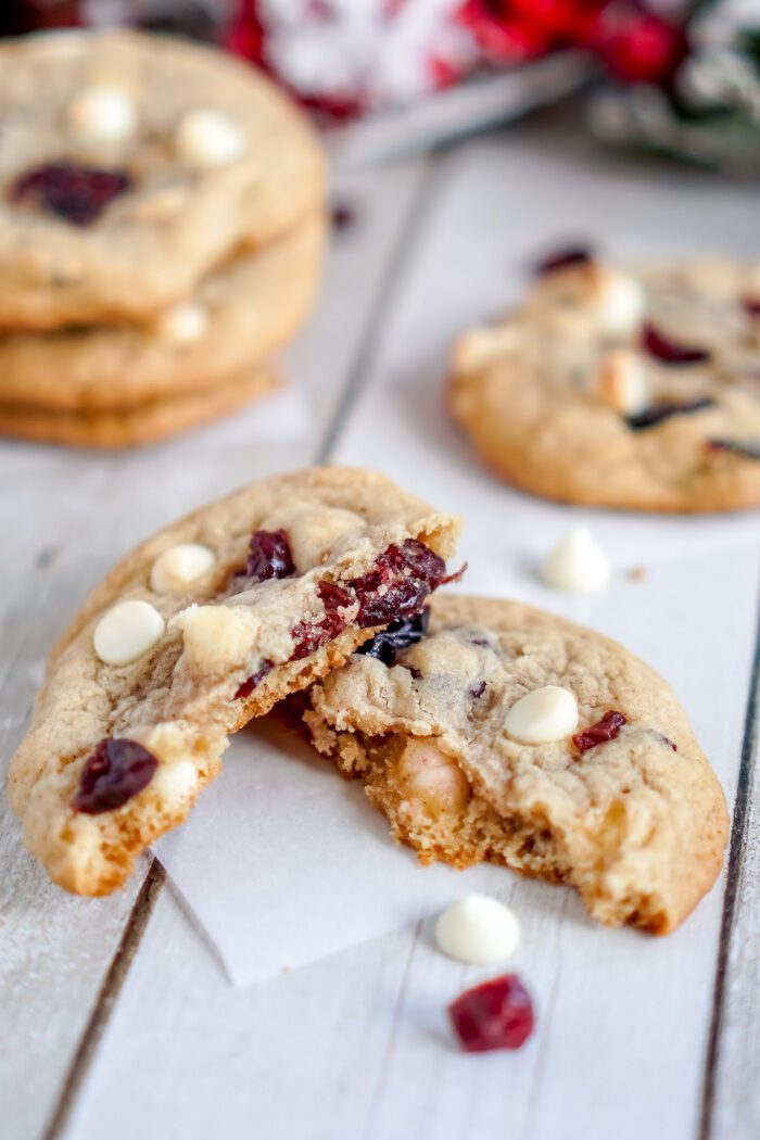 Close up of a Cranberry White Chocolate Chip Cookie broken in half