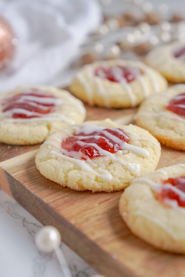 Close up of thumbprint cookies on a cutting board