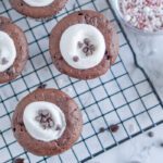 Baked Hot Chocolate Cupcakes filled with a marshmallow and mini chocolate chips