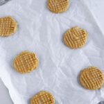 Baked peanut butter cookies on a baking sheet