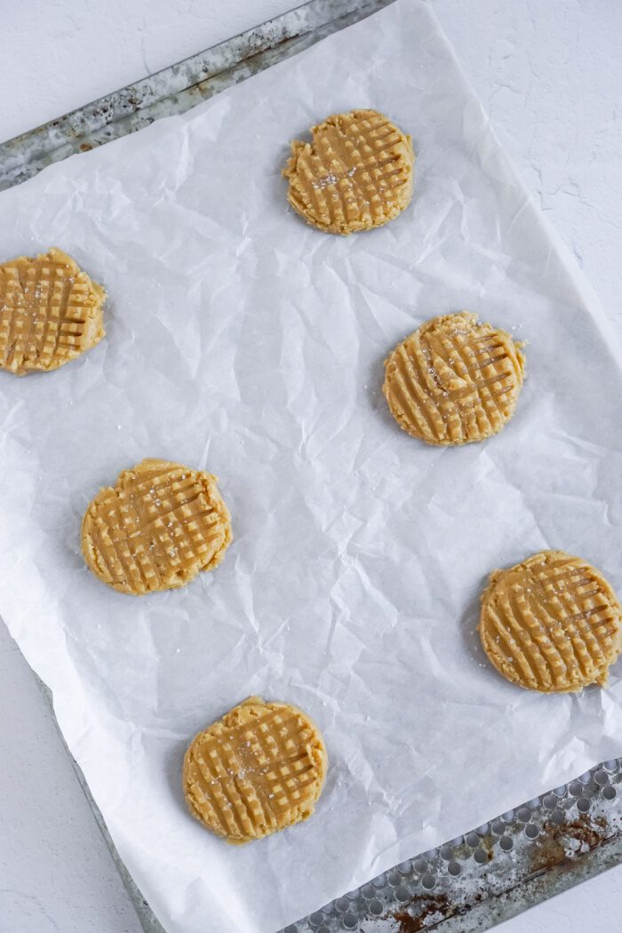 Baked peanut butter cookies on a baking sheet