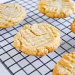 Baked peanut butter cookies on a cooling rack