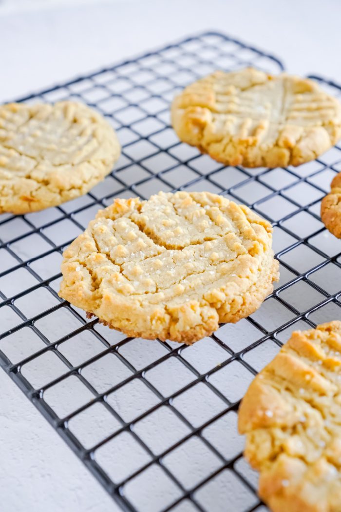 Baked peanut butter cookies on a cooling rack