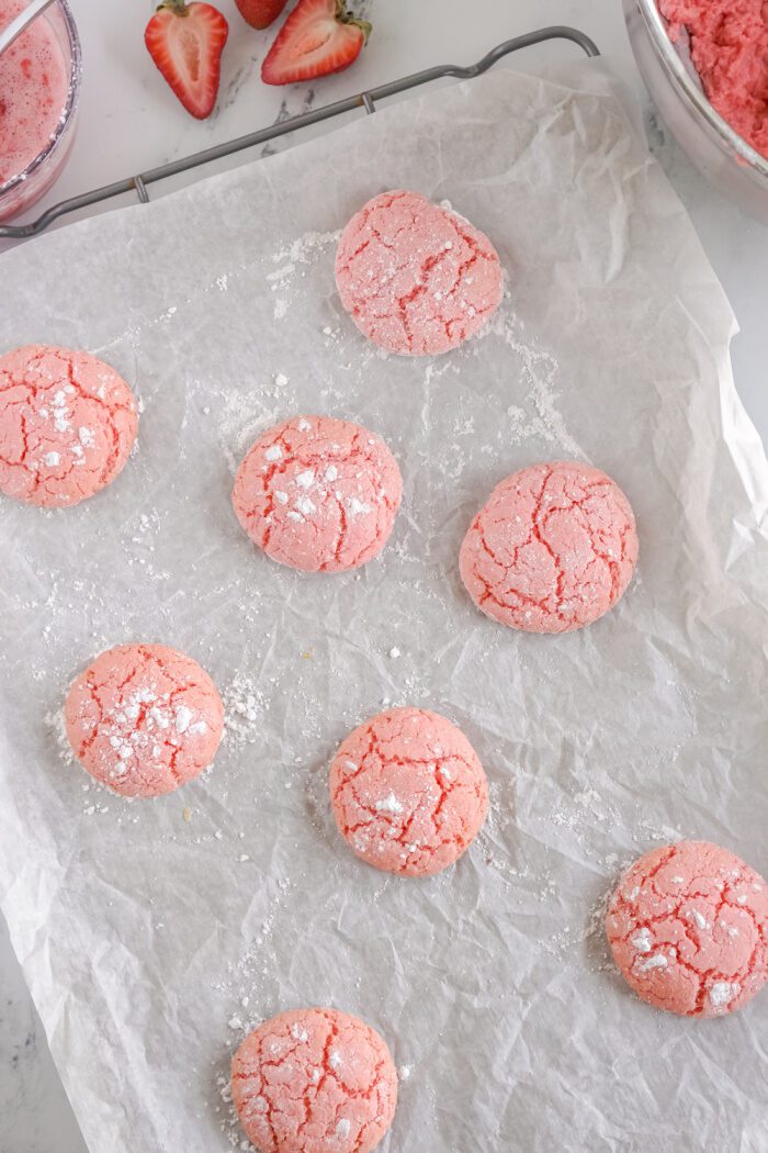 Baked strawberry cookies on a baking sheet