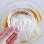 Baking soda being added to bowl