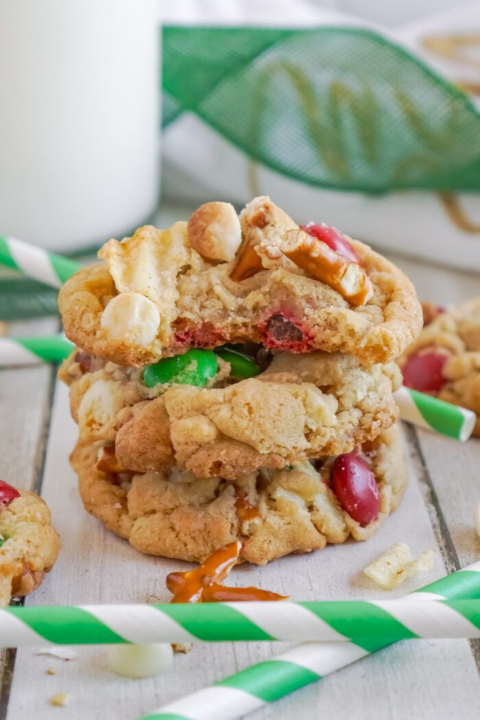 Stack of 3 Kitchen Sink Christmas Cookies and a bite taken out of the top cookie