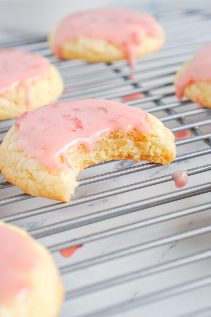 Bite out of Strawberry Glaze Sugar Cookies