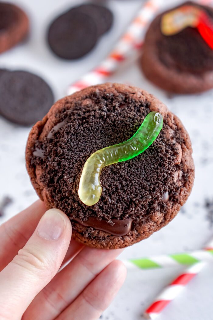 Someone holding an Oreo Dirt Pudding Chocolate Cookie