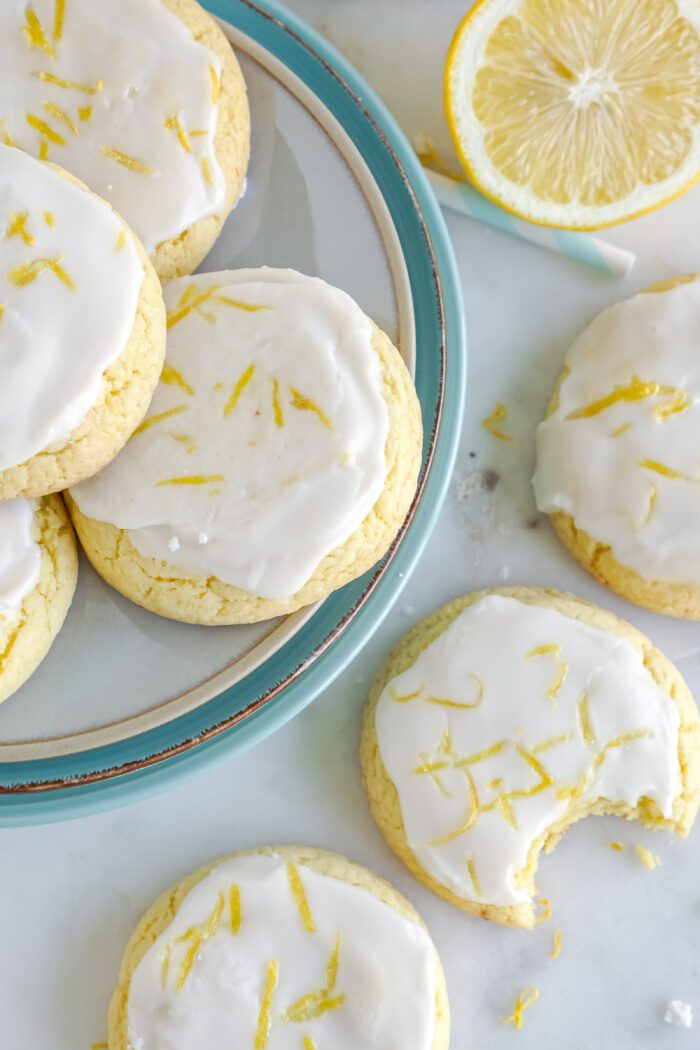 Lemon Cake Mix Cookies on a plate and lined up on the counter