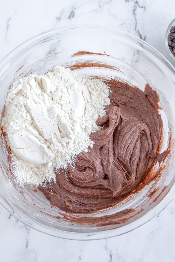 Flour being added to bowl