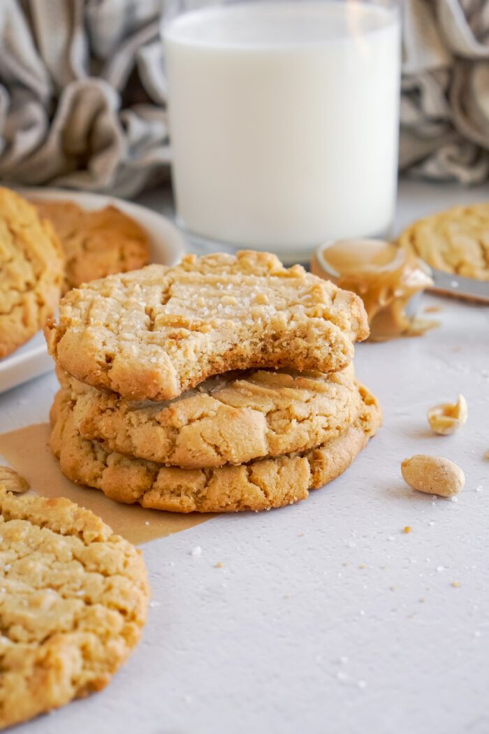 Stack of 3 cookies with a bite taken out of the top cookie