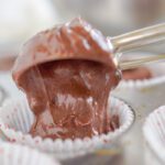 Pouring the Hot Chocolate Cupcake batter into a cupcake liner