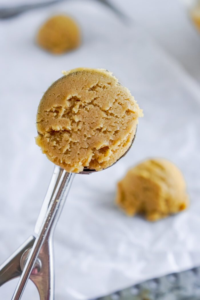 Scooped cookie dough in a cookie dough scoop