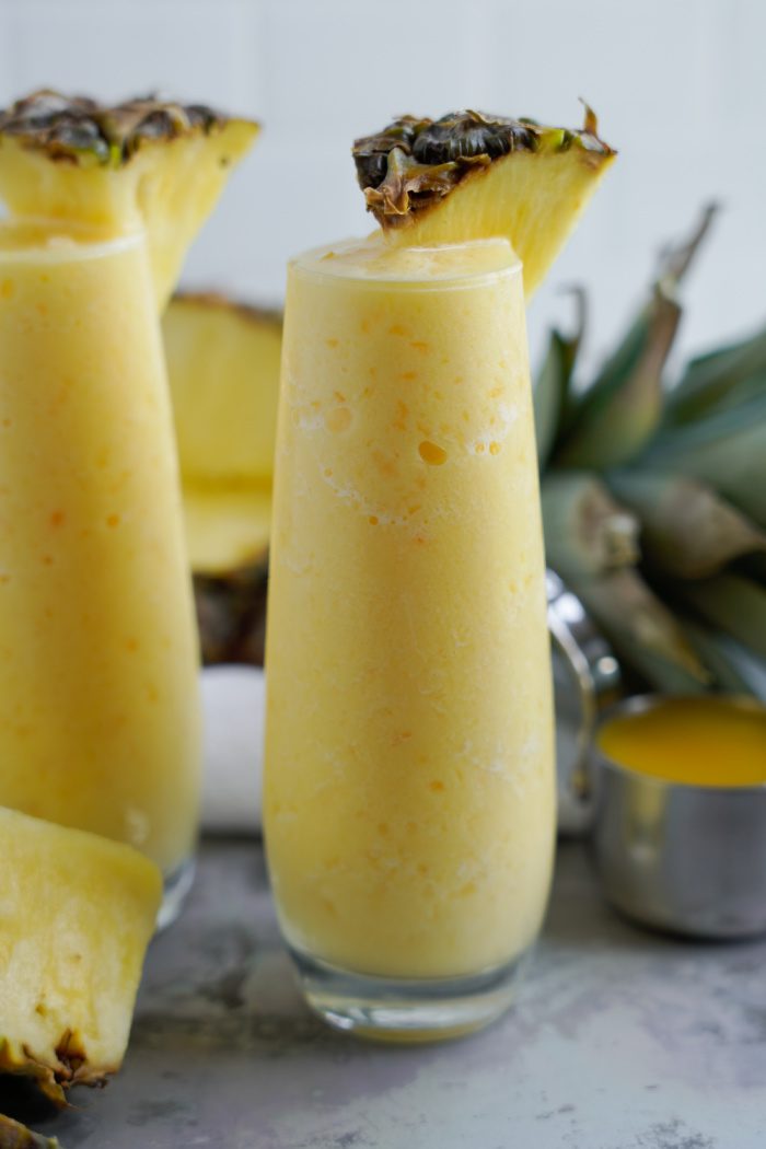 Pineapple smoothies with a pineapple wedge