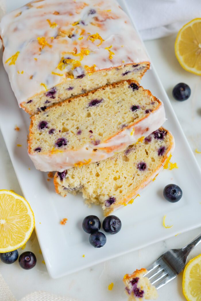 Slices of lemon blueberry loaf on a plate