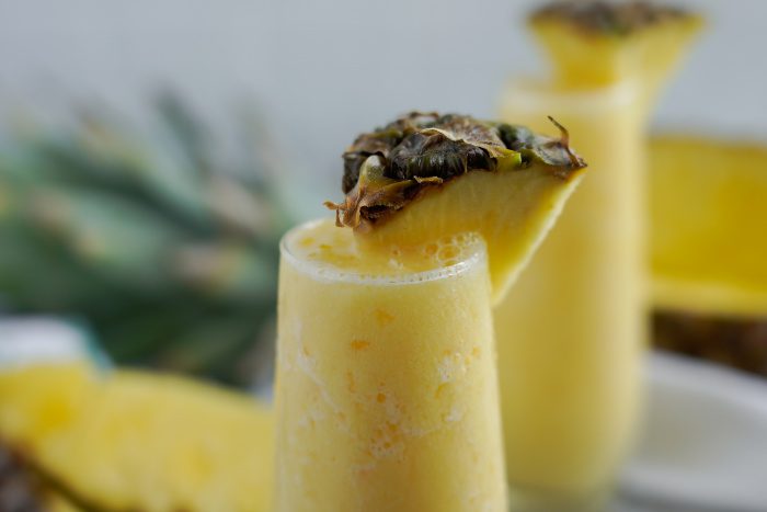 Wide view of a glass of pineapple smoothie