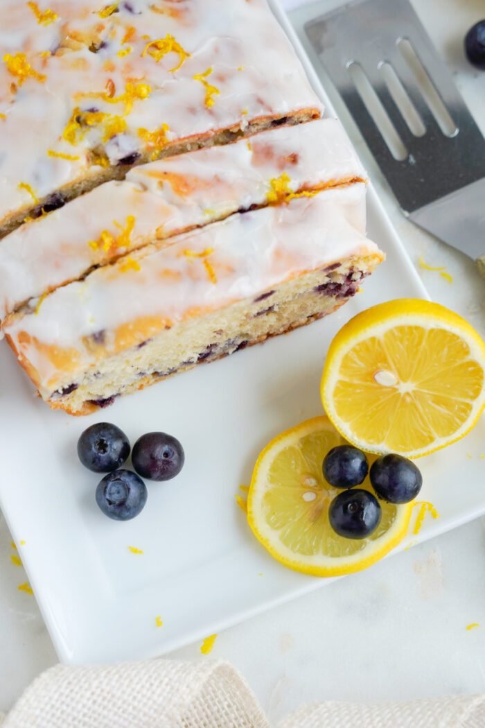 Above view of Lemon blueberry loaf sliced on a plate