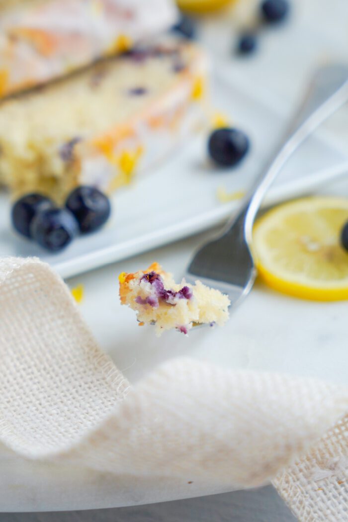 Lemon blueberry loaf bite on a fork