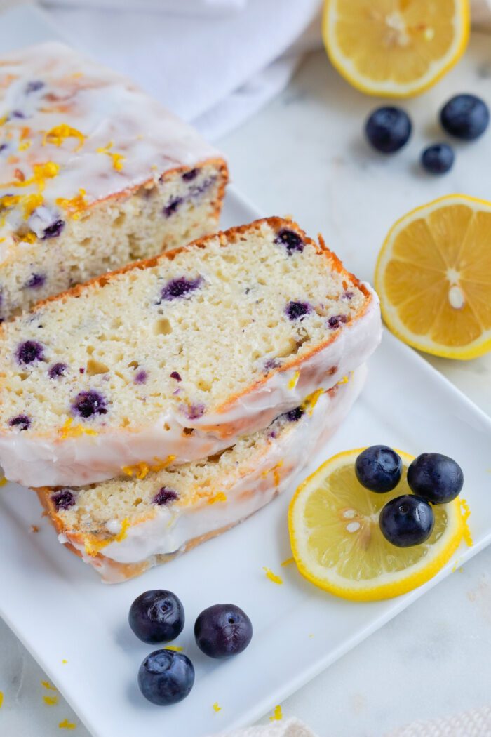 Lemon blueberry loaf slices stacked on each other