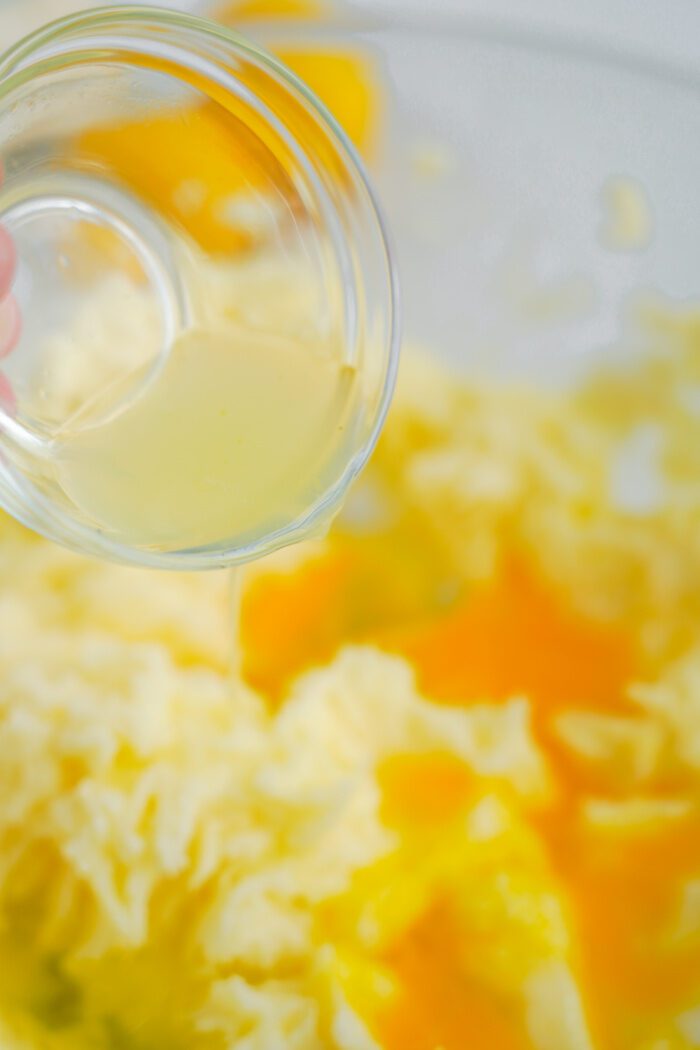 Lemon juice being added to batter