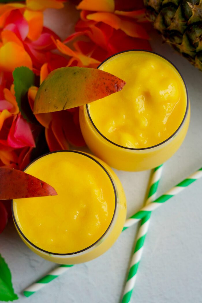 Above view of Mango Smoothies with Mango slices in them