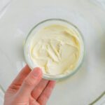 Soften butter being added to bowl