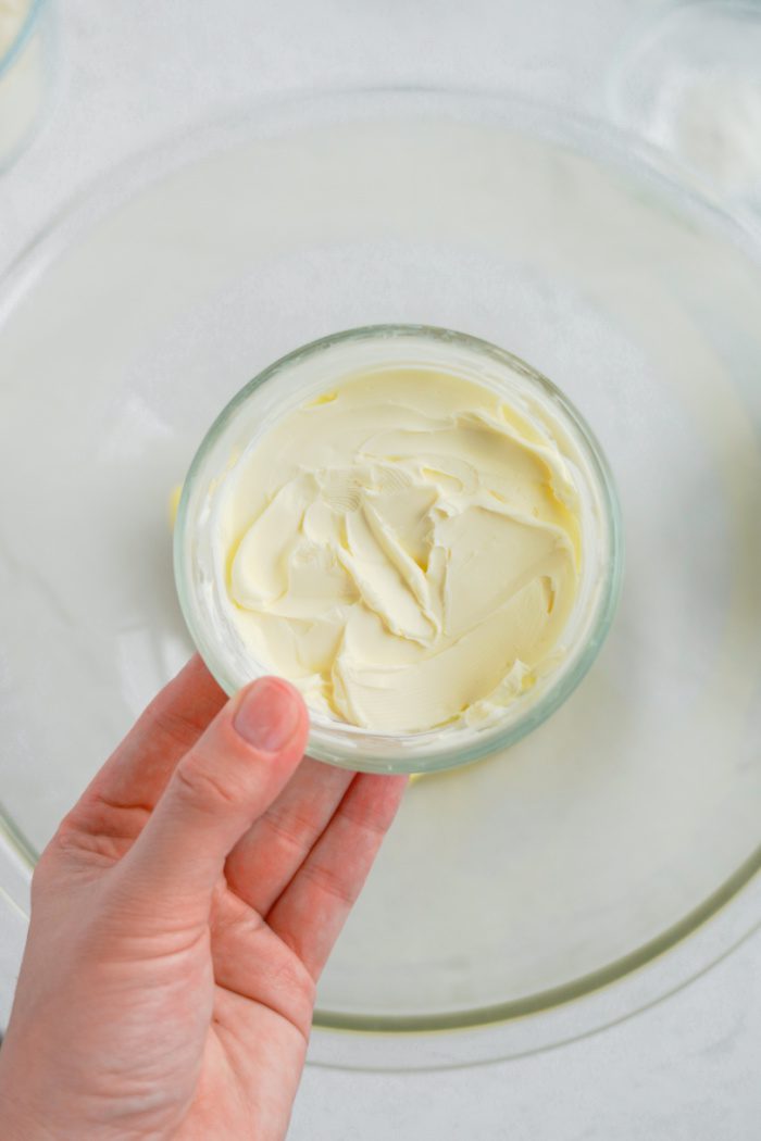 Soften butter being added to bowl