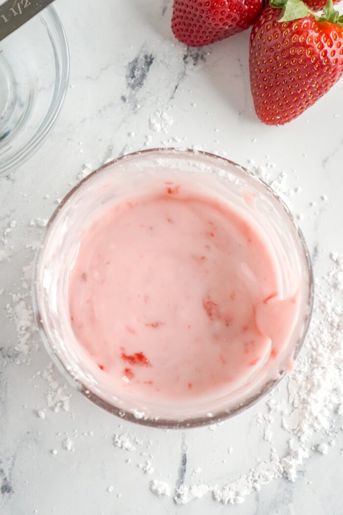 Above view of strawberry glaze in a bowl