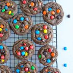 Baked M&M cookies on cooling rack