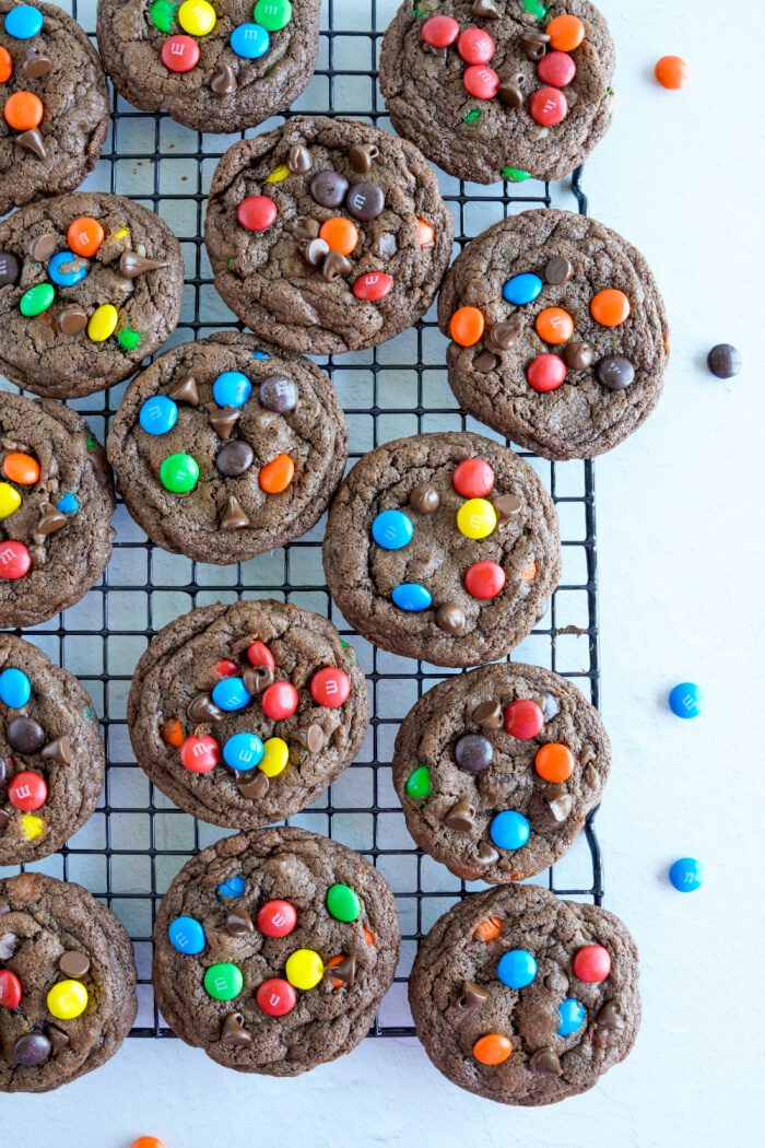 Baked M&M cookies on cooling rack