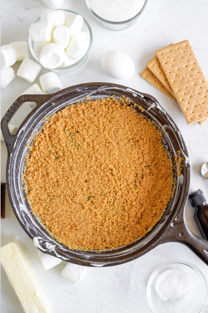 Graham cracker crust pressed into skillet