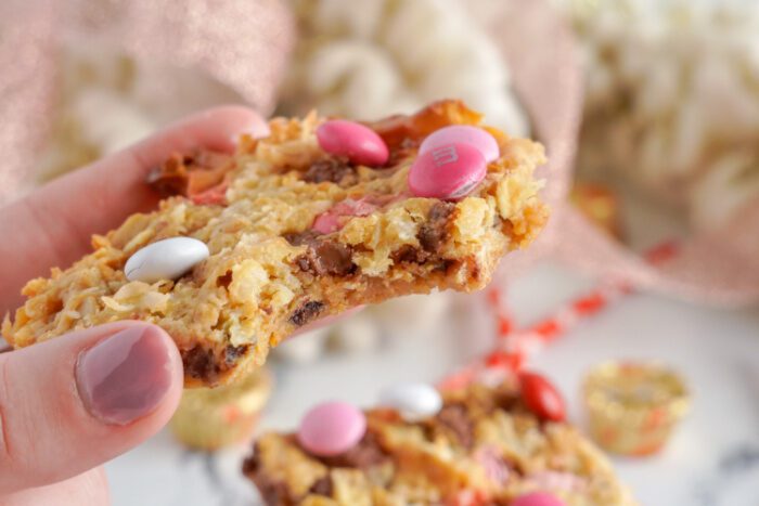 Someone holding a Valentine's Day Magic Bars