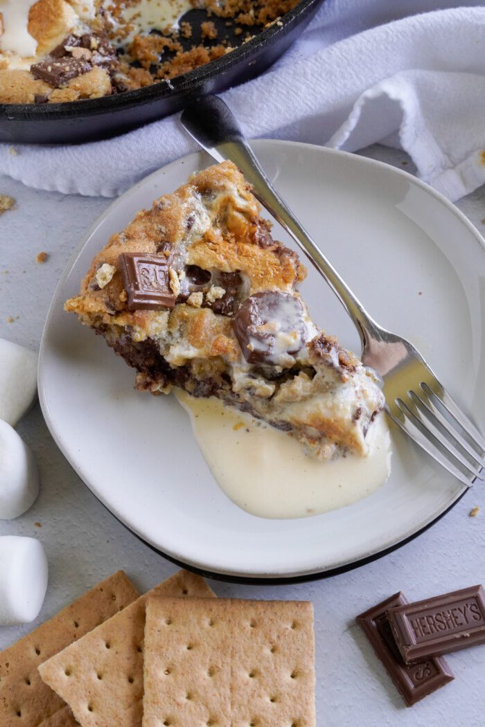 Slice of homemade S'mores Skillet Cookie on a plate