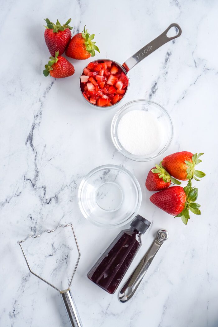 Fresh strawberries, sugar, water, and vanilla extract.