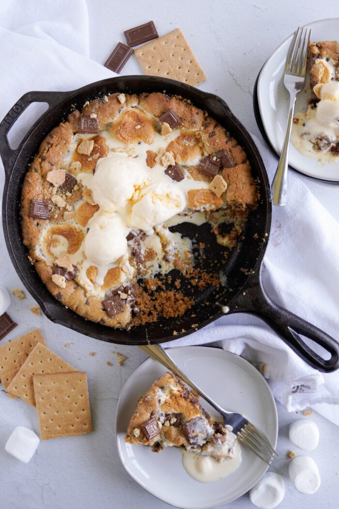 S'mores Skillet Cookie with slices missing from it