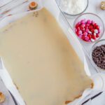 Sweetened condensed milk poured into baking dish