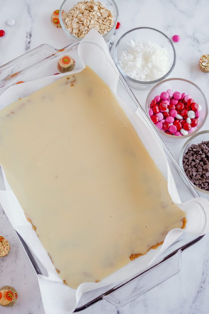 Sweetened condensed milk poured into baking dish