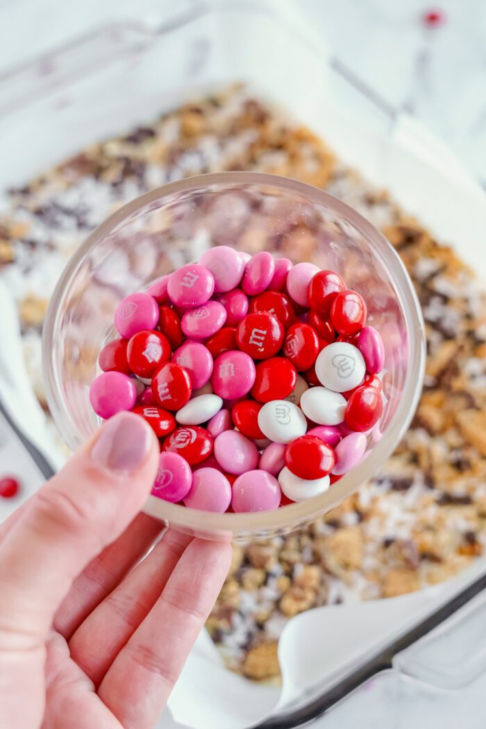 Valentine's M&M being added to the baking dish